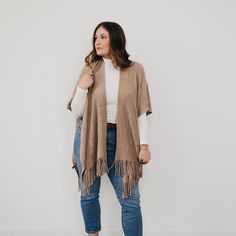 Stay warm in style with this Prince Paisley Shawl! Crafted from 100% soft, high end acrylic, this cool and cozy shawl adds a touch of class to any look. It's perfect for a day in town, brunch with the girls, or on a cozy night in. Fringe and a paisley design? It's a winning combo! Available in 2 colors including black and taupe. Measurements: 37"W x 34"H Material: 100% Acrylic Black Bohemian Pashmina Shawl, Brown Paisley Pashmina Shawl, Luxury Paisley Print Pashmina Shawl, Cozy One-size Brown Shawl, Semi-stitched Bohemian Jamawar Pashmina Shawl, Cozy Shawl, Paisley Shawl, Cozy Night, Paisley Design