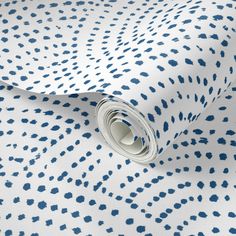 a blue and white wallpaper with small spots on the fabric, it is very soft