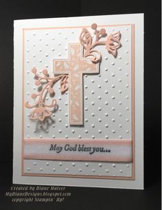 a card with a cross on it and the words may god besy you written in pink