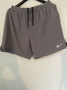 NIKE mens loose dri fit elastic waist Running shorts gray size XL. Condition is "Pre-owned". Shipped with USPS First Class. Gray Moisture-wicking Athletic Shorts For Gym, Gray Sportswear Athletic Shorts, Gray Jogging Shorts, Nike Gray Activewear With Built-in Shorts, Gray Training Sportswear Shorts, Gray Sports Shorts, Gray Sportswear Shorts For Training, Gray Sportswear Athletic Shorts For Workout, Gray Sportswear Shorts For Gym