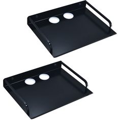 two black trays with white circles on them