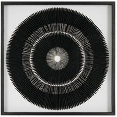 a black and white photo with an abstract design in the center that is made up of sticks