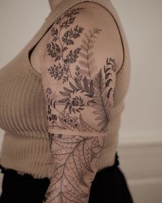 a woman with a tattoo on her arm