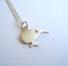 "Cute small sterling silver kiwi necklace, bird pendant, charm necklace. The pendant is 1.2cm/0.5\" tall and 1,9cm/0.8\" wide. Available in sterling silver, yellow gold plated sterling silver, rose gold plated sterling silver. Chain options: 40 cm / 16 inches or 45cm / 18 inches, available in sterling silver, yellow gold plated sterling silver, rose gold plated sterling silver, or no chain. Also available as tiny stud earrings: https://www.etsy.com/listing/150969047/tiny-kiwi-bird-stud-earrings- Sterling Silver Bird Necklace, Silver Bird-shaped Sterling Silver Necklace, Sterling Silver Necklace With Bird Design, Silver Sterling Silver Necklace With Bird Design, Kiwi Bird, Bird Necklace, Bird Pendant, Tiny Studs, Tiny Stud Earrings