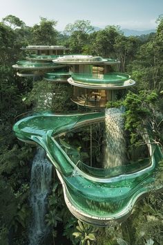 an aerial view of a water slide in the middle of a forest with waterfalls