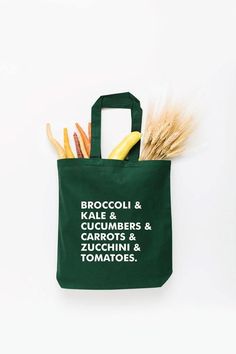 Start tab labels Calling all veggie lovers! Broccoli, kale, cucumbers, take your pick on this tote. Say no to plastic! Take our reusable tote bags to the farmer's market, grocery store, library, beach, you name it. Choose from a variety of sizes and color options. Veggie List, Grocery Store Aesthetic, Say No To Plastic, Zucchini Tomato, Shipping Envelopes, Sioux City, Gardening Apron, Biodegradable Packaging, Market Bags