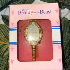 the beauty and the beast keychain is in its box