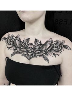 a woman with a black and white tattoo on her chest