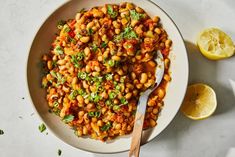 a white bowl filled with chickpeas and garbanzo