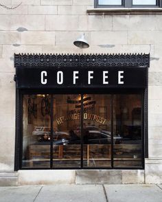 a black and white photo of a coffee shop with the window closed to let people know where they are going