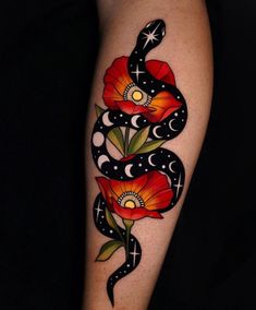 a woman's arm with flowers and a snake tattoo on the left side of her body