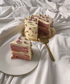 two slices of cake on plates with one slice missing from the rest of the cake