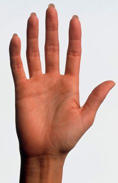 a person's hand reaching up into the air with their left hand extended out