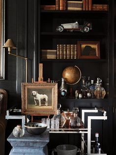 a room filled with lots of books and antiques