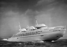 a large white ship in the middle of the ocean