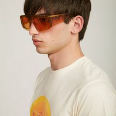 PRODUCT INFORMATIONThe Irene sunglasses are part of the second collaboration with Spanish eyewear brand, MULTIÓPTICAS. The futuristic style, inspired by the 60s and 70s, is designed with a bold, oversized shape in a translucent amber. Featuring orange lenses and a continuation of the iconic three-part logo design in the temples, this style is definitely a standout piece.NON - REFUNDABLE ITEMDETAILS Amber frame Translucent amber temples featuring the PALOMÓ collaboration logo Orange lenses Category 2 – Medium Luminosity 147mm Length – 140mm Wide Glasses arrive in a brown faux leather hard case including a flannel pouch and a black microfiber cloth. Wide Glasses, Collaboration Logo, Tinted Glasses, Plastic Glasses, Futuristic Style, New Sunglasses, Sunglasses Collection, In Sync, Eyewear Brand