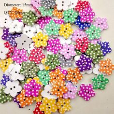 many different colored polka dots and bows on a white surface with the words diamer 15mm