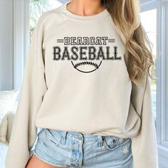 Gear up for success on and off the field with our Custom Baseball Team Sweatshirts, designed to unite your squad in style. Whether you're prepping for game day or celebrating a hard-fought victory, these sweatshirts are the ultimate symbol of team pride. Crafted from premium, ultra-soft fabric, our sweatshirts offer unbeatable comfort and durability, ensuring you stay warm and cozy during those chilly practices and post-game celebrations. But what truly sets them apart is their customizable design – you have the freedom to add your team's logo, name, or any other personalized details that represent your squad's identity. From Little League dreamers to seasoned veterans, our Custom Baseball Team Sweatshirts are perfect for players of all ages and skill levels. Whether you're huddling up in Baseball Team Sweatshirts, Cheap Team Name Sweatshirt For Baseball Season, Baseball Season Team Spirit Hoodie With Team Name, Baseball Season Team Name Sweatshirt, Team-colored Sweatshirt With Team Name For Baseball Season, Team Sweatshirts, Sport Clothes, Graphic Apparel, Crew Sweatshirts