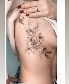 a woman's stomach with flowers on it