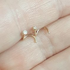 "Genuine Diamond nose stud. Solid 14k gold nose stud. Screw end nose stud. 1.5 mm Diamond solid gold nostril stud. 1.8 Diamond Nose jewelry. Super tiny solid 14k Gold nose stud with 1.5 mm or 1.8 mm genuine diamond. 20 gauge screw end. Shaft is approx. 6 mm or 3/16\". One nose stud. *Please note that body jewelry is not Exchangeable or Refundable. Please ensure you are ordering the correct size. More Genuine solid Gold and Platinum: https://www.etsy.com/shop/waterleliejewellery?ref=hdr_shop_menu Dainty Prong Setting Nose Studs As Gifts, Minimalist Nose Ring With Prong Setting, 14k Gold Nose Studs With Prong Setting Gift, 14k Gold Prong Setting Nose Studs For Gift, Minimalist Round Nose Studs For Anniversary, Nostril Stud, Diamond Nose Ring, Diamond Nose Stud, Gold Nose Stud