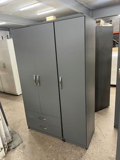 two metal storage cabinets in a warehouse