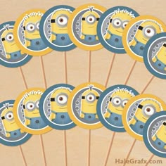 minion cupcake toppers are arranged on sticks