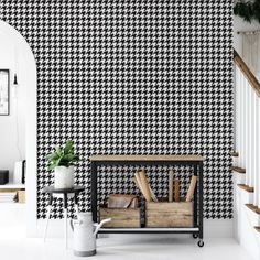 a black and white checkered wallpaper in a living room next to some stairs