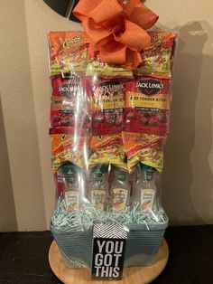 a gift basket filled with hot dogs and condiments for someone's birthday