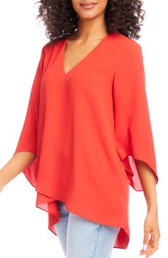 An elegant top of silky, lightweight crepe delivers elegant movement with its angled flare sleeves and fluttery asymmetrical hemline that dips low in back. 25 1/2" length (size Medium) V-neck Three-quarter sleeves Back yoke with gathering Crossover high/low hem 100% polyester Dry clean or hand wash, line dry Made in the USA of imported fabric Women's Clothing Elegant Spring Blouse With Asymmetrical Hem, Elegant Asymmetrical Blouse With Draped Sleeves, Elegant Blouse With Draped Asymmetrical Sleeves, Spring Formal Top With Asymmetrical Hem, Formal Spring Top With Asymmetrical Hem, Formal Tops With Asymmetrical Hem For Spring, Chic Viscose Blouse With Flutter Sleeves, Versatile Asymmetrical Evening Blouse, Spring Workwear Blouse With High-low Hem