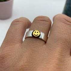 "**Spread Happiness with Our Smiley Face Ring!  🌞 **Radiate Positivity This smiley face ring is more than just jewelry; it's a symbol of joy and happiness. Gift it to your boyfriend or best friend to share smiles and good vibes. 🎁 **Ideal Christmas or Birthday Gift Looking for a unique Christmas or birthday gift for your boyfriend or best friend? This cool emoji ring is a thoughtful and fun present that's sure to brighten their day. 🌟 **Adjustable for Comfort Crafted with versatility in mind, this adjustable ring ensures a comfortable fit for any finger. Its simplicity and charm make it suitable for any occasion. ⭐ **Why Choose Our Smiley Face Ring - **Joyful Design A symbol of happiness and positivity. - **Perfect for Loved Ones Show your affection with this cool smiley ring. - **Versa Novelty Smiley Face Jewelry As Gift, Novelty Smiley Face Jewelry For Gifting, Novelty Smiley Face Jewelry For Gifts, Novelty Smiley Face Jewelry Gift, Fun Handmade Rings For Gifts, Fun Handmade Rings As Gifts, Handmade Fun Rings As Gifts, Adjustable Fun Rings For Gifts, Smiley Face Ring As Gift