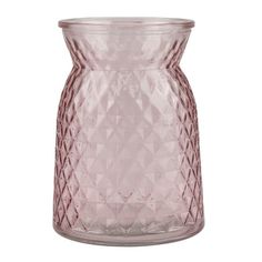 a pink glass vase sitting on top of a white table