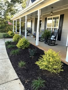 the front porch is clean and ready to be used as an outdoor space for relaxing