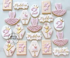 decorated cookies are arranged in the shape of baby's first year names and numbers