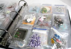 an assortment of assorted jewelry and accessories in a plastic bag on a table top