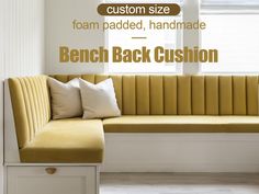 a bench with pillows on it in front of a window that says custom size foam padded, handmade bench cushion