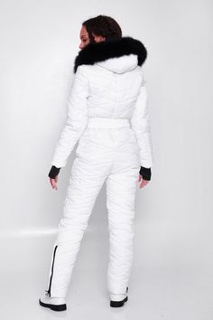 White ski suit for women is made of quality waterproof fabric and modern filler that does not cause allergies and is able to stay warm even at temperatures of -13°F (-20-25°C).The design and cut of the ski jumpsuit are thought out to the smallest detail. You will love the zippered pockets and the strap that fits well to the body for a feminine silhouette.You will also be delighted with the large fur hood. The fur and hood are removable. On the sleeves of the snowsuit there are knitted cuffs with White Long Sleeve Winter Jumpsuits And Rompers, White Long Sleeve Jumpsuits For Winter, White Fitted Winter Jumpsuit, White Fitted Jumpsuits And Rompers For Winter, Fitted White Jumpsuits And Rompers For Winter, Winter Outdoor Long Sleeve Jumpsuits And Rompers, Fitted Jumpsuits And Rompers For Winter, White Fitted Ski Season Outerwear, Fitted White Skiing Outerwear