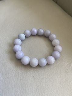 🌈 13.5mm Jadeite Beaded Bracelet, Light Lavender & Green 🌷 Untreated Natural Jadeite/ Grade A Jade 🌷 Certified : YES 🌷 Jade from Myanmar/ Burma 🌷 Bead size : 13.5 mm 🌷 Color : Light Lavender & Light Green 🌷 Free shipping from Hong Kong by with tracking number provided 🌷 Take approximately 7-28 days to arrive worldwide Lavender 8mm Beads Jewelry For Healing, Formal Natural Stone Round Bead Bracelets, Elegant Round Amethyst Beaded Bracelets, Elegant Lavender Beaded Bracelets With Gemstone, Elegant Lavender Gemstone Beaded Bracelets, Elegant Lavender Crystal Bracelet With Round Beads, Elegant Lavender Beaded Bracelet For Healing, White Amethyst Beaded Bracelets, White Amethyst Jewelry With 8mm Beads