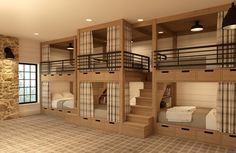 there are bunk beds in the room with curtains on each bed and two sets of stairs to the second floor