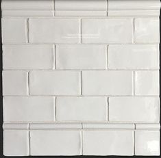 a white brick wall with black border