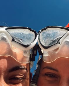 two people wearing goggles and protective gear