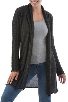 Paola Cuentas designs a feminine long cardigan in sleek dark gray. Knitted of genuine 100% alpaca the cardigan features patterned textures on the sleeves to contrast with the solid body. The ample front subtly rolls inwards to remain open. Gray Cable Knit Sweater Coat For Fall, Charcoal Long Sleeve Sweater, Soft Knit Alpaca Cardigan For Fall, Gray Cable Knit Cardigan For Layering, Alpaca Cardigan For Fall, Long Sleeve Alpaca Cardigan For Fall, Alpaca Cardigan, Cardigan Winter, Stormy Weather