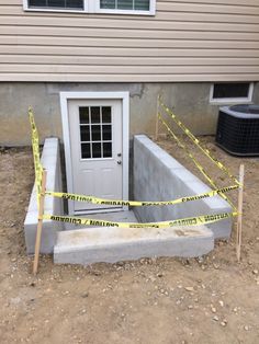 the entrance to a house is taped off with caution tape