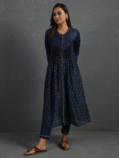 Indigo Block Printed Handwoven Pintuck Chanderi Kurta with Mul Slip & Pants (Set of 3) By The Neem Tree now available at Trendroots Indigo Cutdana Kurta For Eid, Blue Long Sleeve Kurta With Gota Work, Elegant Long Sleeve Sets With Pintucks, Indigo Designer Straight Kurta, Designer Indigo Straight Kurta, Indigo Designer Wear Straight Kurta, Indigo Kurta For Navratri, Indigo Kurta For Navratri Festive Season, Indigo Festive Kurta For Navratri