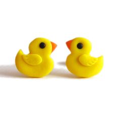 two yellow rubber ducks sitting next to each other