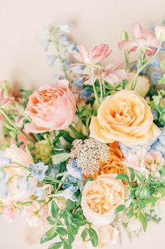 a bunch of flowers that are sitting in the middle of some kind of flower arrangement