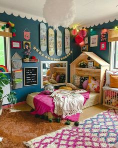 a child's bedroom decorated in pink, blue and white