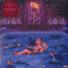 the album cover for pink floyd's new album, that features an image of a woman sitting in a pool surrounded by other people