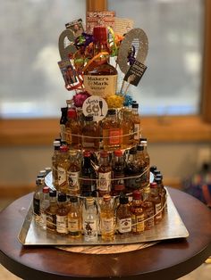 a cake made out of liquor bottles on top of a table