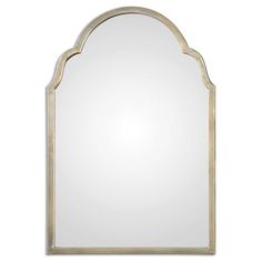 a large mirror with an arched frame