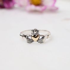 RNG Silver Claddagh Ring with Bronze Heart Symbolic Heart Shaped Wedding Rings, Symbolic Heart-shaped Wedding Ring, Symbolic Heart-shaped Promise Ring, Promise Ring With Crown Design, Symbolic Heart Ring For Valentine's Day Gift, Claddagh Ring Meaning, Symbol Of Friendship, Silver Claddagh Ring, Friendship Symbols